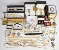 A collection of jewellery including three silver bangles with scrolling decoration, silver locket,