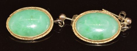 A pair of yellow metal earrings set with jadeite cabochons, 4.8g, 2.2cm
