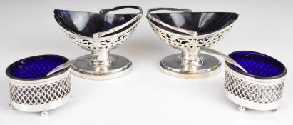 Pair of Dutch silver swing handled salts with blue glass liners and spoons to suit, together with
