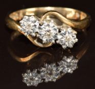A 9ct gold ring set with three diamonds in a platinum setting, 2.8g, size N