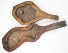 Two 18th/19thC carved treen butter moulds with fish decoration, tallest 26cm