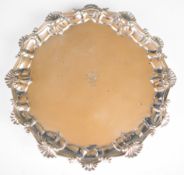 Georgian hallmarked silver salver with shaped edge, raised on three hoof feet, London 1761, maker