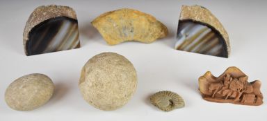 A pair of polished agate geode bookends, ammonite fossil and circular stone ball / boulle with two