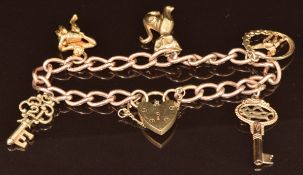 A 9ct gold charm bracelet with five 9ct gold charms including cat, naked man with pail, key, etc,