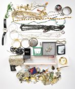A collection of jewellery including bangles, glass beaded necklace, silver gilt necklace, agate