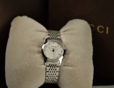 Gucci ladies wristwatch ref. 126.5 with date aperture, luminous hands, mother of pearl dial, diamond