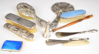 Hallmarked silver mounted dressing table items comprising hand mirror, three various brushes, two