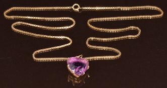 A 9ct gold pendant set with a heart cut amethyst of approximately 18ct, on 9ct gold chain made up of