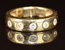 A 14k gold ring set with five round cut diamonds, 4.9g, size L