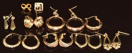 Seven pairs of 9ct gold earrings including knots and hoops, and three single earrings, 8.3g