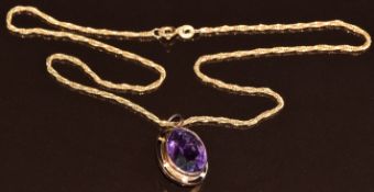 A c1900 9ct gold pendant set with an oval cut amethyst, 5.5g, 38cm, 2 x 1.5cm