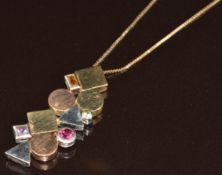 A 9ct gold tricoloured abstract necklace set with an amethyst, citrine, peridot and topaz on 9ct