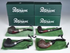 Four Peterson smoking pipes comprising 30 System Spigot Rusticated, Pipe of the Year 2021, Deluxe