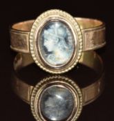 A 9ct gold ring set with a painted cameo, 3g, size P