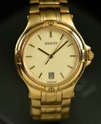 Gucci wristwatch ref. 9240M with date aperture, gold hands and hour markers, champagne dial, gold