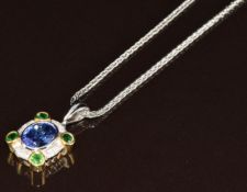 An 18ct white gold pendant set with an oval cut tanzanite of approximately 2.4ct, diamonds totalling