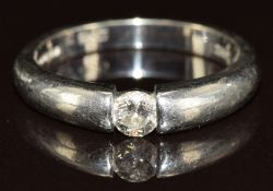A platinum ring set with a round brilliant cut diamond of approximately 0.25ct, 5.7g, size N