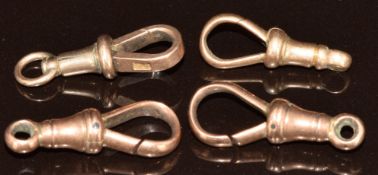 Four 9ct gold dog clips, 7.1g