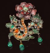 An early 19thC silver gilt pendant / brooch set with foiled emeralds, citrines and rose cut paste,