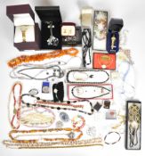 A collection of costume jewellery including beaded and crystal necklaces, Whitby jet and mother of
