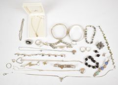 A collection of silver jewellery including bangles, four bracelets, identity bracelet, enamel