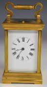 Repeating brass and bevelled glass carriage clock striking on a gong, height including handle 15cm