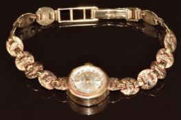 Accurist 9ct gold ladies wristwatch with gold hands and hour markers, silver dial and signed 21