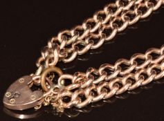A 9ct rose gold bracelet made up of double curb links, with 9ct gold heart padlock clasp, 34.7g
