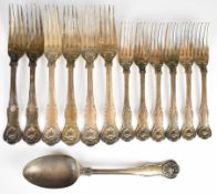 Victorian part canteen of hallmarked silver cutlery with shell finials, comprising table spoon and