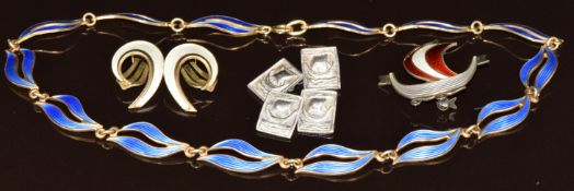 Three pieces of Norwegian silver jewellery including necklace set with blue enamel, earrings set