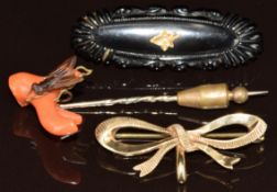 Victorian jet brooch set with a seed pearl in a leaf shaped setting, 9ct gold bow brooch (3g) and