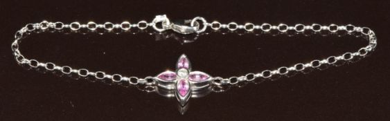 An 18ct white gold bracelet set with a diamond and pink sapphires, 3.3g, 19cm