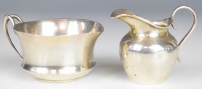 Victorian hallmarked silver milk jug, Birmingham 1889, maker's mark LS, together with a George V