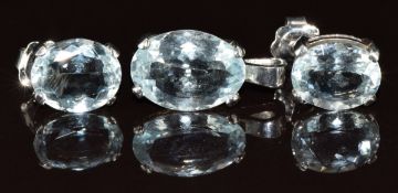 A white metal pendant set with an oval cut aquamarine of approximately 4ct and a pair of 18ct