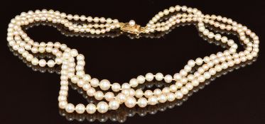 Mikimoto three strand cultured pearl necklace, the 14k gold clasp set with a further pearl, 41.8g,