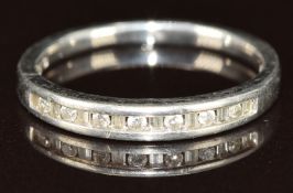 A platinum half eternity ring set with alternating baguette and round cut diamonds, 3.5g, size K/L