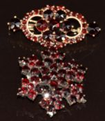 A 9ct gold brooch set with Bohemian cut garnets (5.1g, 3.5cm) and a silver gilt brooch set with