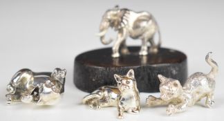 Three modern hallmarked silver novelty miniature models of cats, length of longest 4.5cm, weight