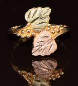 A 10k Black Hills gold bi-coloured ring in the form of leaves, in original Landstrom's box, 2.6g,