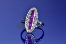An 18ct white gold ring set with calibre cut rubies and diamonds, 3.4g, size O