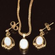 A 9ct gold pendant set with an opal on 9ct gold chain and similar earrings, 6.3g, 39cm