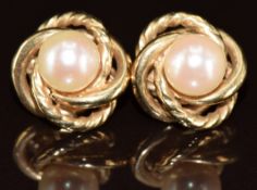 A pair of 9ct gold knot earrings each set with a pearl, 6.1g