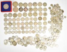 Approximately 1395g pre-1947 British silver coinage to include a boxed 1935 George V rocking horse
