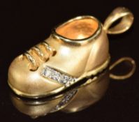 A 14k gold charm in the form of a shoe set with diamonds, 3g, 2cm
