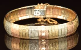 An 18k gold tri-coloured bracelet made up of textured rectangular links, 25.6g, 18cm