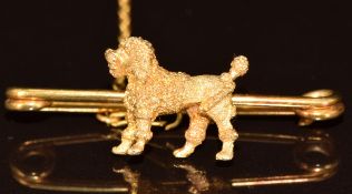 A yellow metal c1900 brooch in the form of a poodle, 4.9g, 4cm
