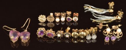 Nine pairs of 9ct gold earrings including c1900 pair set with a heart cut amethyst, diamond studs,
