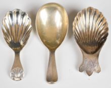 Three 20th century hallmarked silver caddy spoons comprising a Victorian shell shaped example with