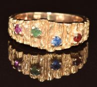 A 9ct gold ring set with a ruby, emerald, sapphire and garnet, 3.3g, size J
