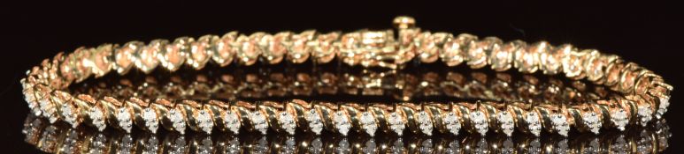 A 9ct gold bracelet set with diamonds, 10.4g, 19cm